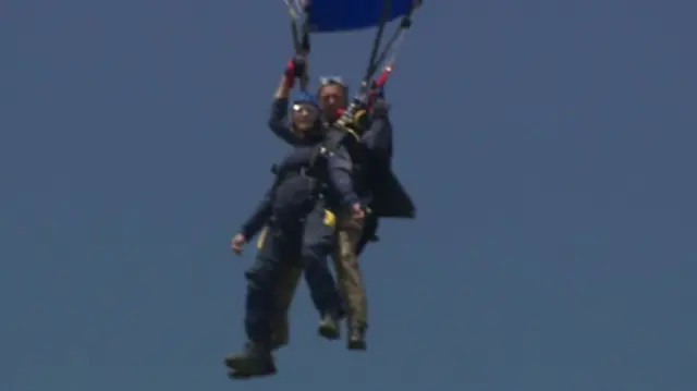 People skydiving