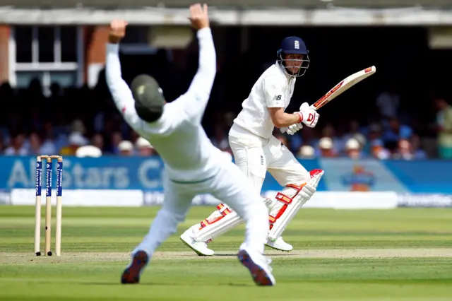 England's Joe Root is dropped on 16