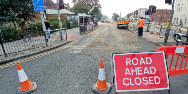 Road surface and road closed sign