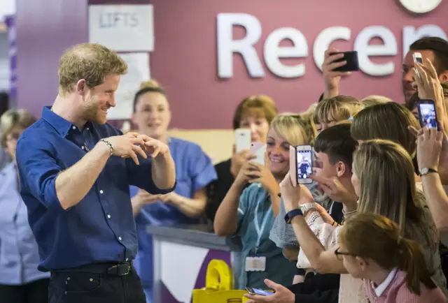 Prince Harry poses for pictures at Leeds Children's Hospital
