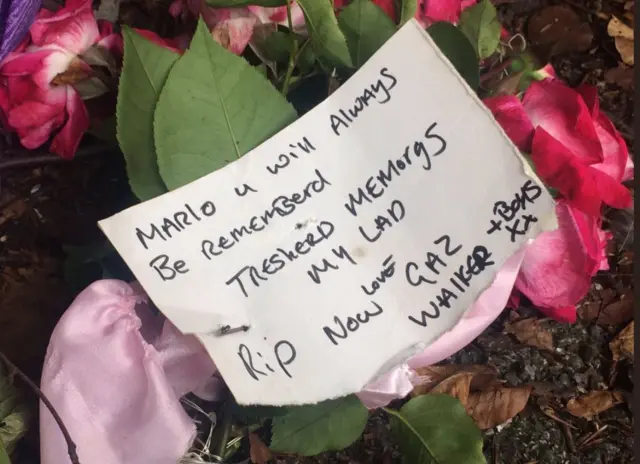 tribute flowers with message