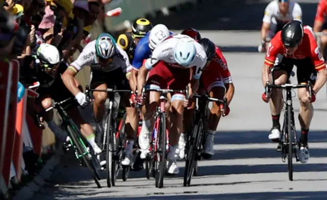 Mark Cavendish (left) crashes out of the race after tangling with Peter Sagan