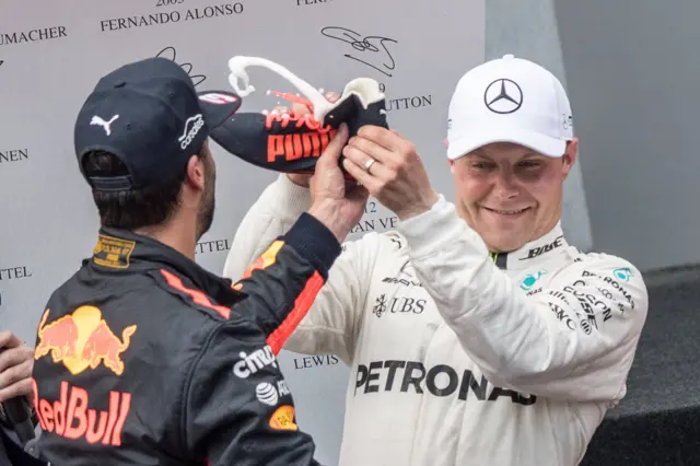 Valtteri Bottas turns down a 'shoey' from Daniel Ricciardo