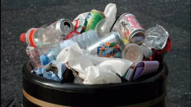 Piles of rubbish in a bin