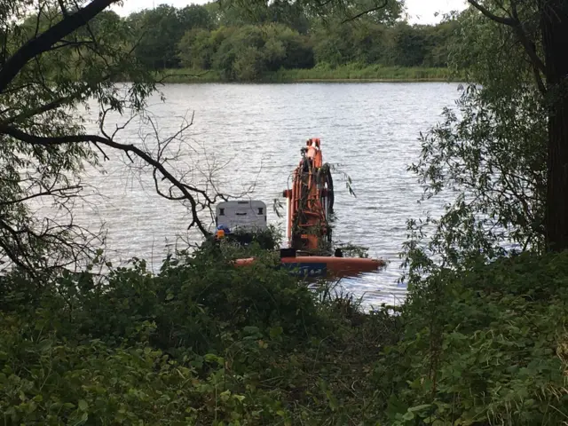 Digger in water at Irthlingborough Lakes and Meadows