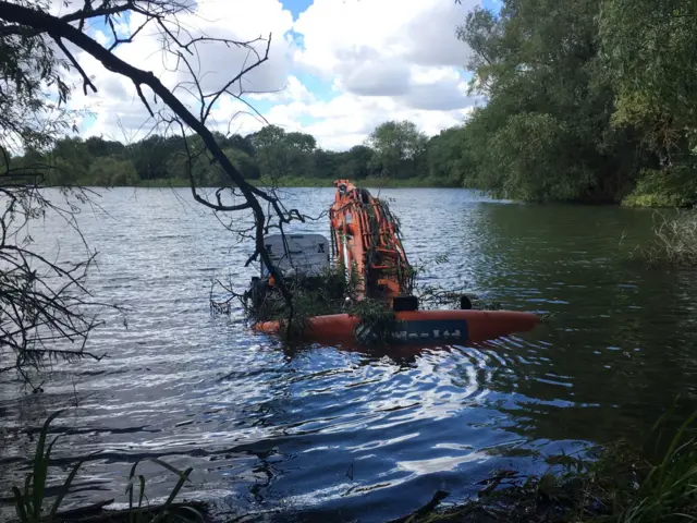 Digger in the lake at Irthlingborough Lakes and Meadows