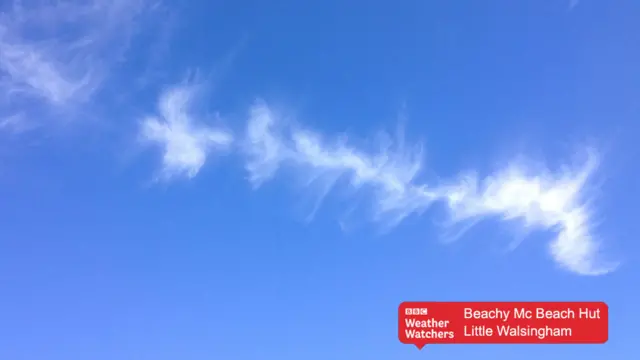 Wispy clouds in blue sky