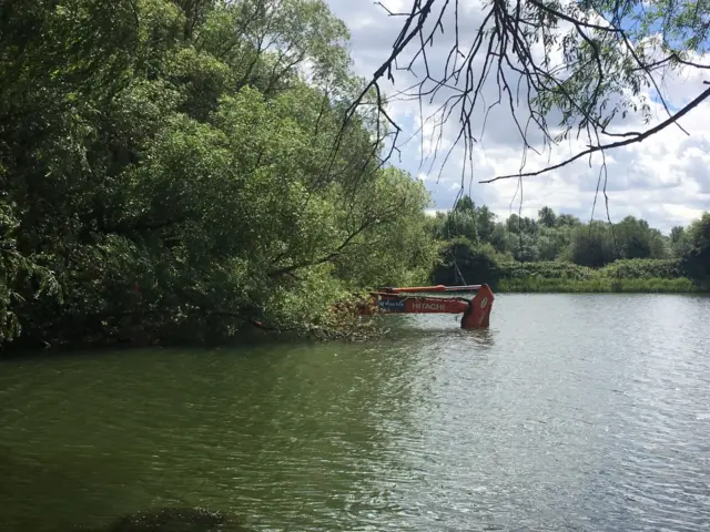 Digger in a lake at Irthlingborough Lakes and Meadows