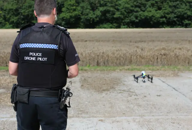 Drone police pilot, with drone,