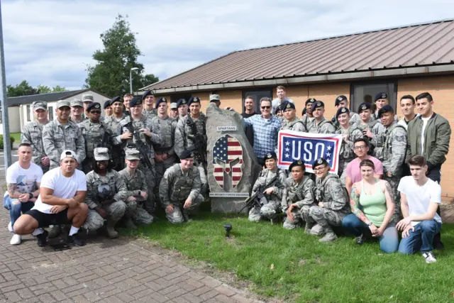 Bryan Cranston with airmen assigned to the 48th Security Forces Squadron