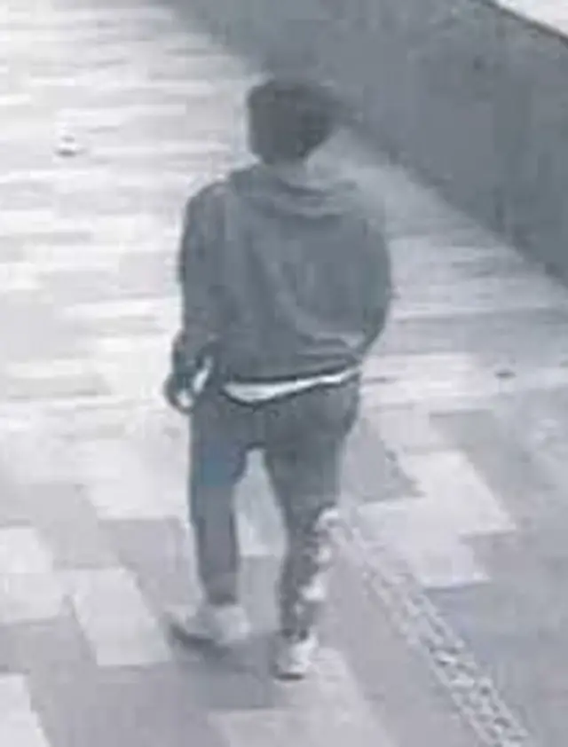 CCTV image of man from back