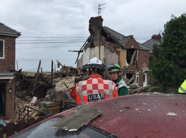 Rescue services at scene of explosion