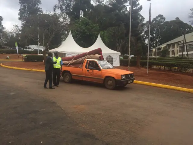 Orange van with carpet on top