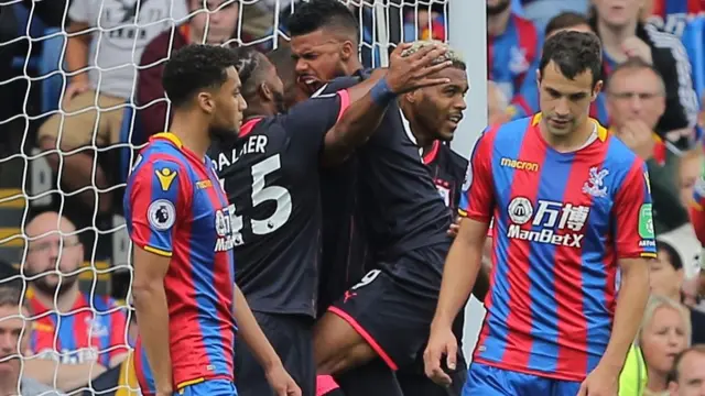 Elias Kachunga of Huddersfield Town celebrates scoring the opening goal