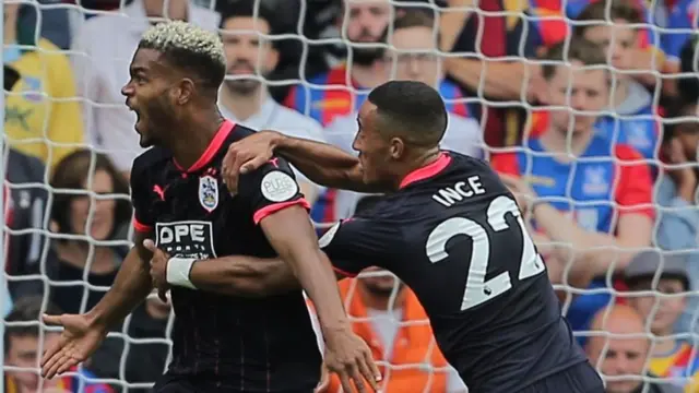 Steve Mounie of Huddersfield Town celebrates scoring his sides second goal