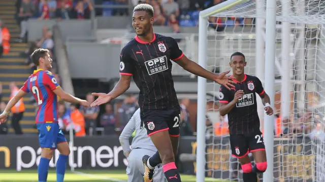 Steve Mounie of Huddersfield Town celebrates