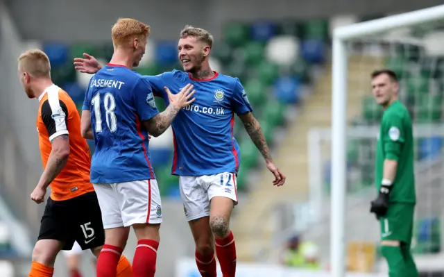 Celebrations for Linfield's Kirk Millar after he made it 2-0 against Carrick Rangers