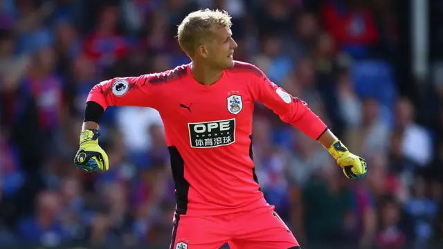 Jonas Lossl of Huddersfield Town celebrates