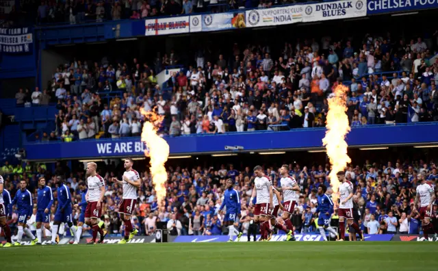 Chelsea and Burnley come on to the pitch at Stamford Bridge