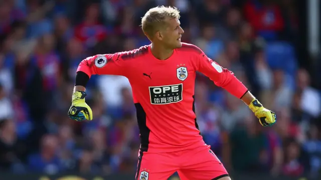 Jonas Lossl of Huddersfield Town celebrates