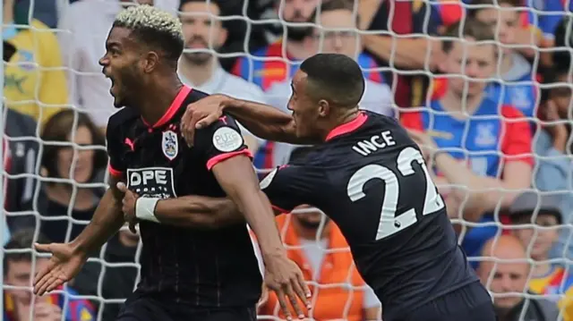 Steve Mounie of Huddersfield Town celebrates scoring his sides second goal