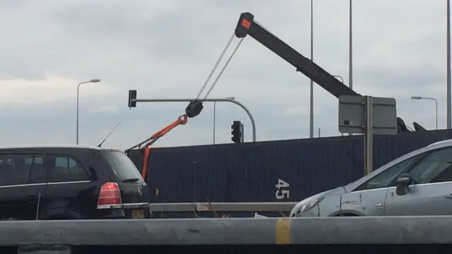 A crane over the overturned lorry