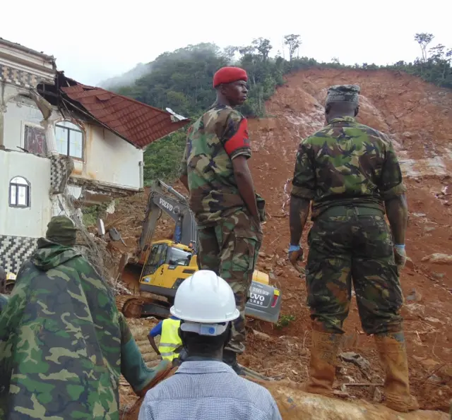 Sierra Leone military view damage caused by a mudslide in the suburb of Regent behind Guma reservoir, Freetown, Sierra Leone, 14 August 2017.