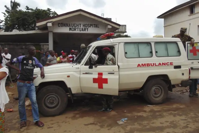 An ambulance arrives at Connaught Hospital Mortuary following a mudslide in the suburb of Regent behind Guma reservoir, Freetown, Sierra Leone, 14 August 2017.