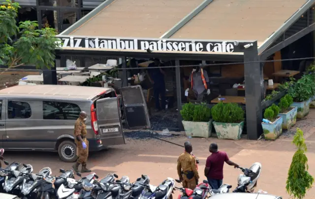 Security forces stand outside the Aziz Istanbul restaurant after an overnight raid in Ouagadougou, Burkina Faso August 14, 2017.