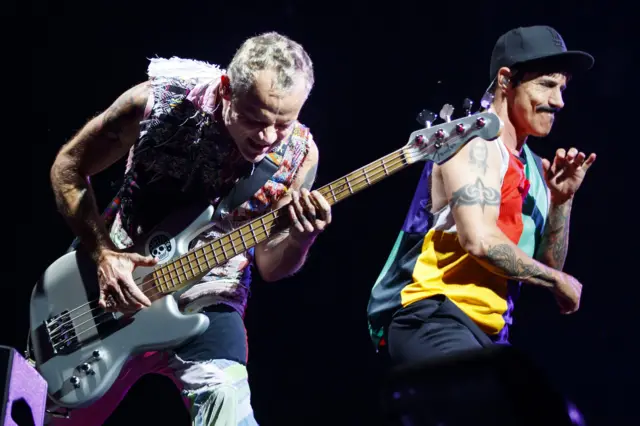 Flea of Red Hot Chili Peppers (left)