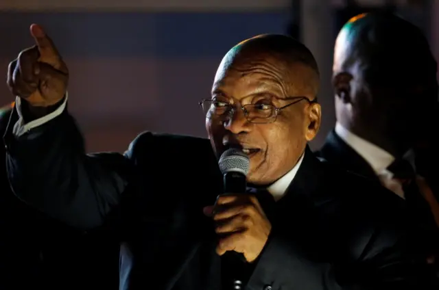 Jacob Zuma celebrates with his supporters after he survived a no-confidence motion in parliament in Cape Town, South Africa, August 8, 2017