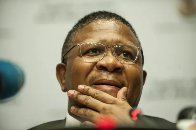 Fikile Mbalula gestures as he helds a press conference addressing FIFA allegations that South Africans were involved in a massive bribery scandal on March 17, 2016 at the South African parliament in Cape Town