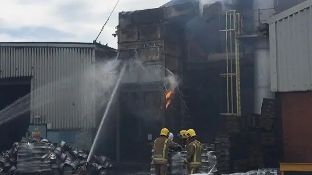 Water being poured onto the blaze