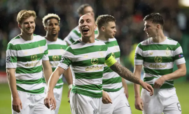 Celtic captain Scott Brown and some of his team-mates enjoy the post-match celebrations.