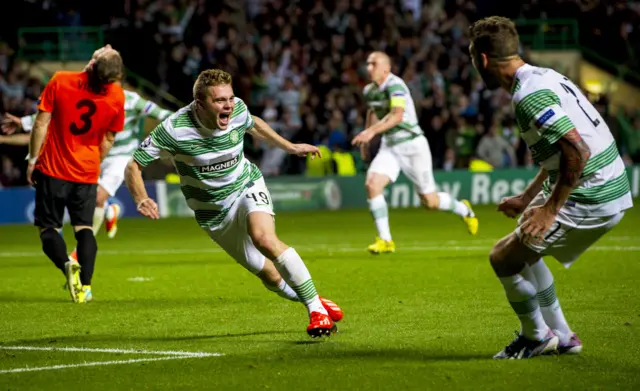 James Forrest celebrates scoring Celtic's third against Shakhter Karagandy in August 2013