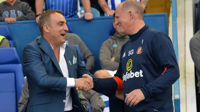 Carlos Carvalhal manager of Sheffield Wednesday greets Simon Grayson manager of Sunderland