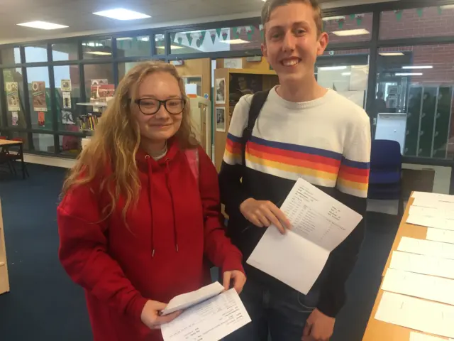 Rebecca and Daniel picking up their AS results