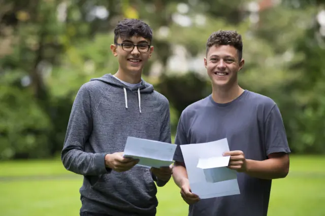 Adam Frangakas-Williams (L) and Daniel Davies receive their A Level results at Ffynone House School in Swansea