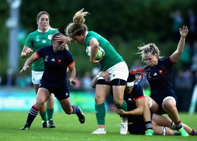 Jenny Murphy of Ireland trying to keep possession.