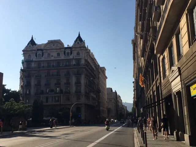 Some pedestrians are pictured but the road is almost entirely clear of traffic