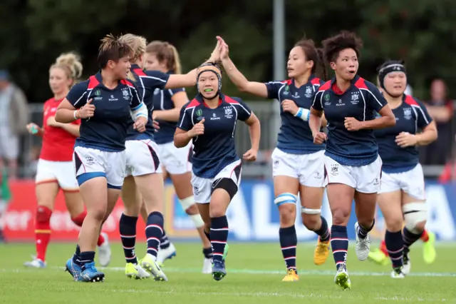 Hong Kong players celebrate a try