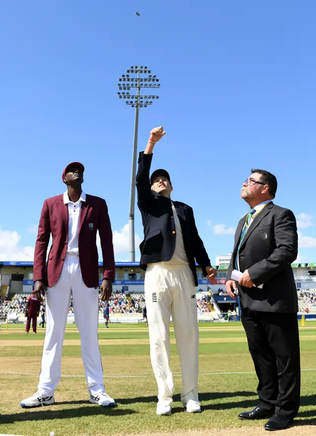 England captain Joe Root tosses coin