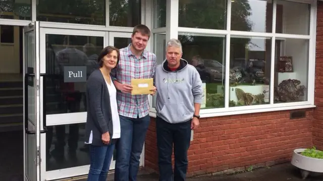 Adam Holding with mum and dad Donna and Andy