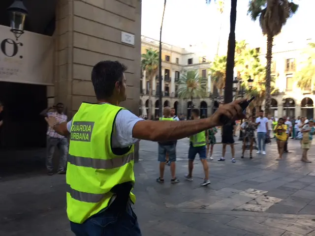 A police officer guides people away from area