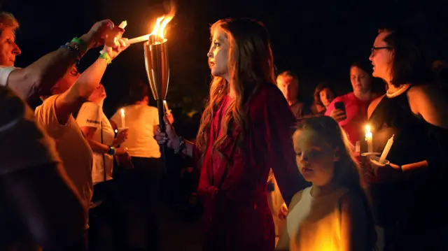 Lisa Marie Presley leads the vigil at Graceland