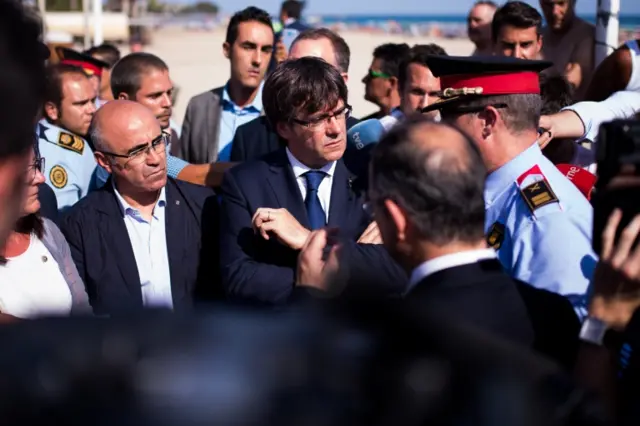 Catalan leader visitis town where five suspects were shot dead