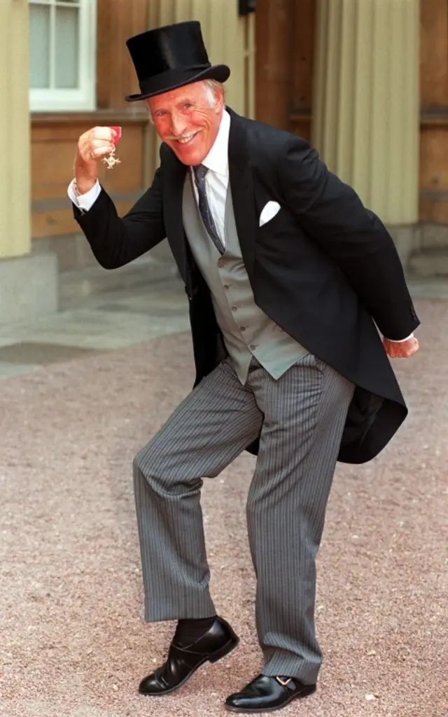 Sir Bruce Forsyth with his OBE