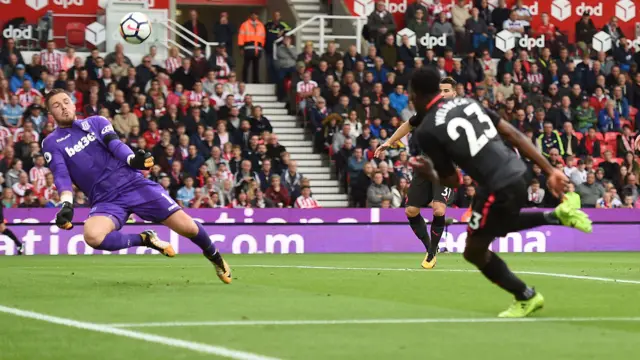 Jack Butland of Stoke City makes a see from Danny Welbeck of Arsena