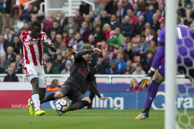 Aaron Ramsey vies with Mame Biram Diouf