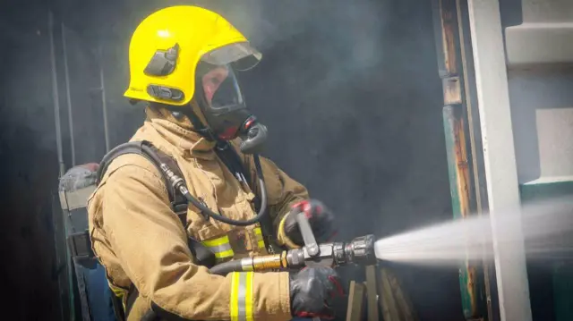 Firefighter taking on the blaze